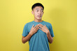 © Heru - Young Asian man trying to be patient look at copy space