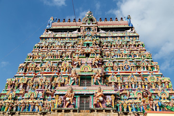 Hindu temple in Tamil Nadu, South India.  Sculptures on Hindu temple gopura (tower), sculpture of an Indian deity