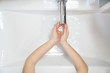 © andrey - washing of kid hands  soap foam and water