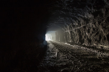 Canvas Print - Underground magnezite mine tunnel with fog and light