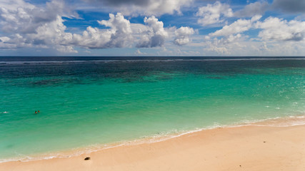 Wall Mural - Tropical beach and sea with blue sky background. Aerial view. Bali, Indonesia.