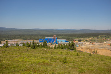 Wall Mural - Mining site with mine headframe landscape view