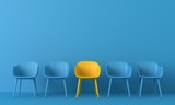 Fototapeta  - Yellow chair standing out from the crowd. Business concept. 3D rendering