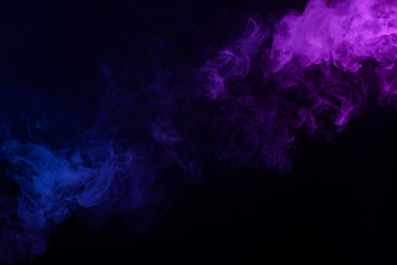 Wall Mural - multicolored smoke or fog blue and purple on black background