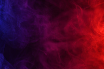 Wall Mural - blue pink and red smoke flowing dark abstract background