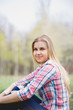 © DSMT - Beautiful girl in flowering trees in early spring. Bright sun and nature