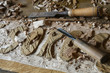 Carving chestnut wood with chisel and gouge