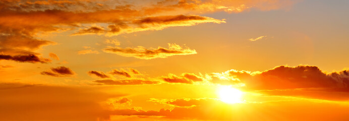 Wall Mural - mellow sunset sky landscape background natural color of evening cloudscape panorama with setting sun