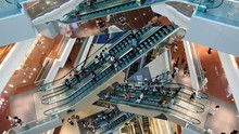 Time Lapse Crowd Of People In Shopping Mall. Escalators In Modern Shopping Mall.