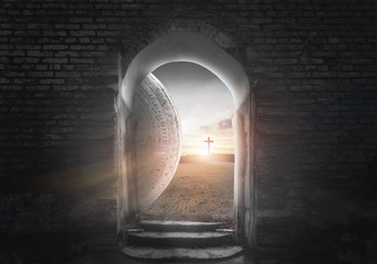 Wall Mural - Easter Sunday concept: Tomb empty with cross on sunset background