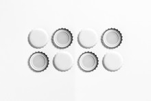 White Beer Caps Mockup Isolated On Soft Gray Background, Front And Backside, Top View. Empty Metal Soda Caps Mockup Design Template.High-resolution Photo.
