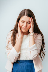 Wall Mural - long-haired beautiful brunette girls have a toothache