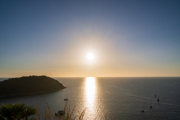 Wall Mural - beautiful sunset on andaman sea at windmill view point near laem promthep cape, phuket, thailand