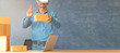 © chiew - Future Technology and Business Concept:The Man with Glasses of Virtual.Laptop computer at workplace of start up, small business owner. cardboard parcel box of product for deliver to customer.