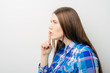 © aeroking - profile woman with silence hush sign gesture saying hush be quiet copy space isolated on white background