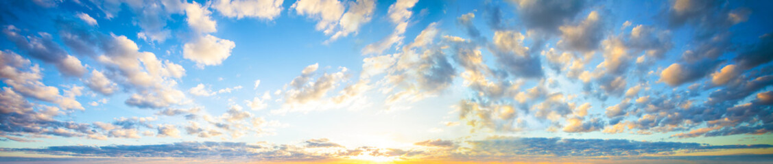 Wall Mural - blue sky clouds background. beautiful landscape with clouds and orange sun on sky