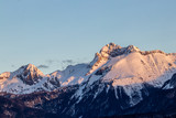 Fototapeta Góry - Sunlit Triglav peak from Bohinj valley, early light