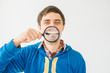 © aeroking - on a gray background young man with a magnifying glass