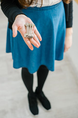 on a gray background young girl holds the keys