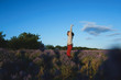 happy woman jumping in lavender field