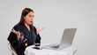 © South House Studio - woman works freelance from home, she use her laptop computer to read fresh news, she got surprised, she wears home asian robe and isolated over white