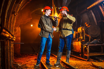 Two miners in the mine