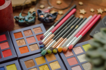 Close-up of make-up eye shadow palettes with shadow brushes