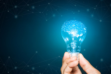 Wall Mural - light bulb hold in hand on blue background, Brain with shining wireframe, Neural networks and artificial intelligence