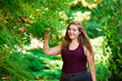 Single Young Pretty Plus Size Caucasian Happy Smiling Laughing Girl Woman, Walking In Summer Green Forest. Fun Enjoy Outdoor Summer Nature.