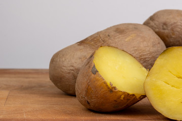 boiled potato on wooden background