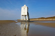 Lighthouse on Burnam-on-Sea Beach at low tide	