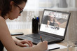 © justoomm - The girl is engaged in online education