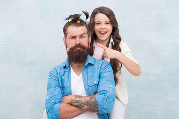 I did it. little girl made funny hairstyle for daddy. daughter and dad playing together. hairstylist her future career. father enjoying time with child. togetherness. spending time together at home