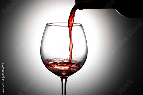 red wine pouring into glass Canvas Print