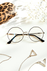 Stylish women's glasses and accessories. Optics store, eye health care.