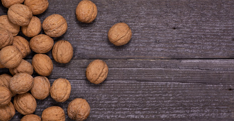 scattering of walnuts on a wooden background