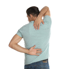 Wall Mural - Man suffering from pain in back on white background. Visiting orthopedist