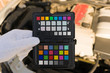 © ANUPAB - Professional photographer hold colorchecker passport card in first shot before shoot for commercial, wedding, fashion, pack shot for calibrate color in camera raw file to correct or true color.