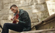 © shyshka - Lovely young street musician with guitar