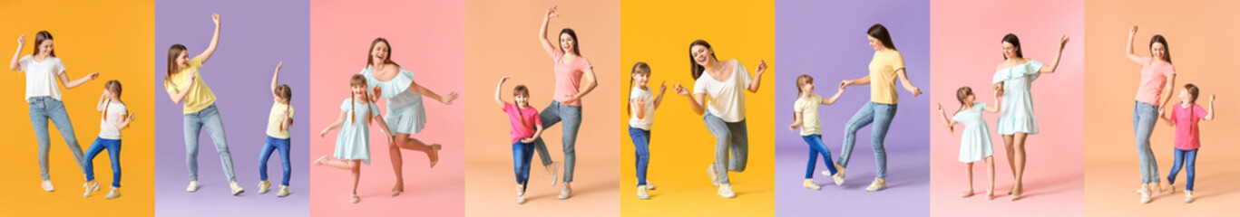 Wall Mural - Happy mother and her little daughter dancing against color background