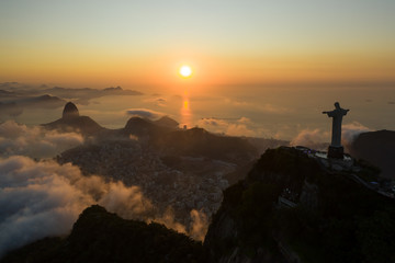 Wall Mural - Drone view of Christ the Redeemer during the sunrise over Guanamara Bay in Rio de Janeiro