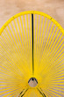 © visualspectrum/Stocksy - Yellow String Chair Detail