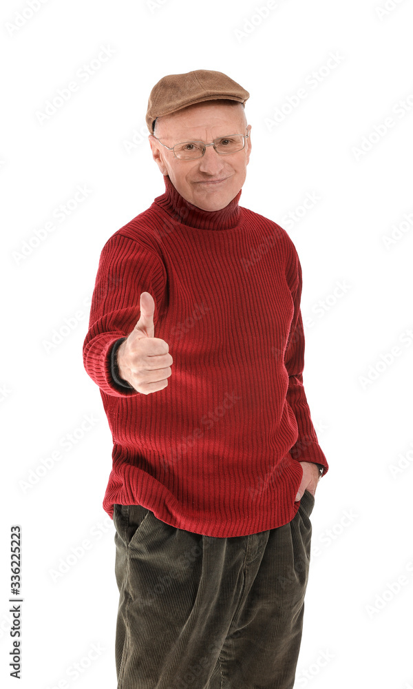 Portrait of elderly man showing thumb-up gesture on white background