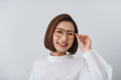 © Maki Company Limited/Stocksy - Glasses eyewear woman happy portrait looking at camera