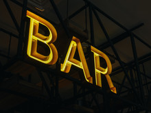 Glowing Bar Sign On Metal Construction