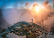 © Patrick Luchs/Stocksy - trailrunner in front of sunset clouds