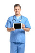 © Pixel-Shot - Portrait of young male doctor with tablet computer on white background