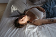 © Sergey Filimonov/Stocksy - Sensual plump female lying on bed