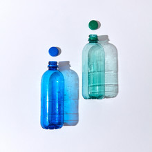 Two Plastic Bottles With Cap On A Light Background