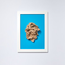 Crumpled Sheet Of Paper In A Blue Frame On A Light Background